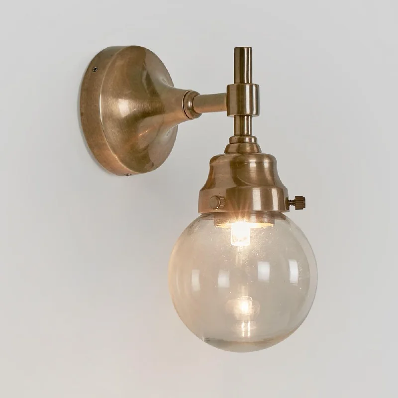 leather wall lamps with a distressed texture for a rugged and stylish lookIceberg Outdoor Wall Light Antique Brass