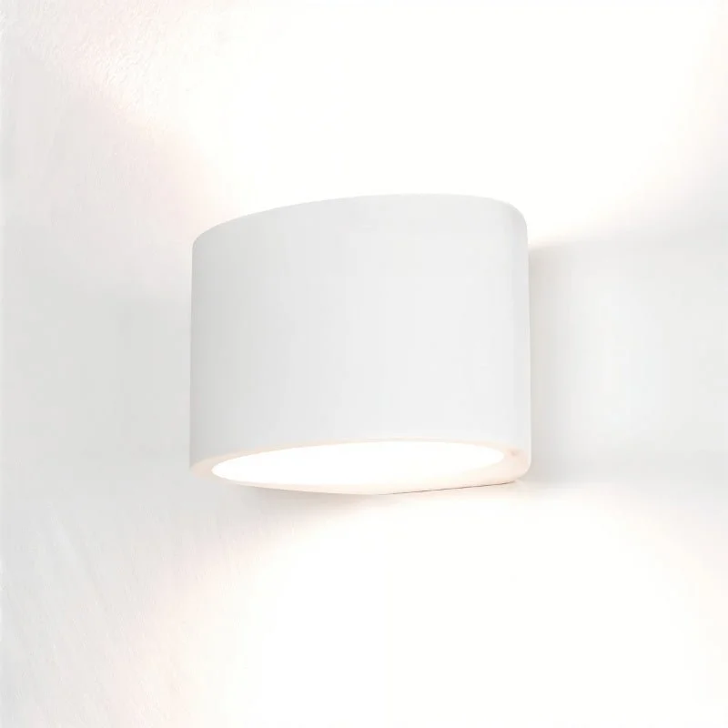 wood wall lamps with natural grain for a warm and organic feelEira Wall Lamp