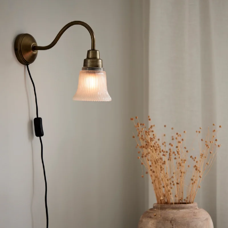 wood wall lamps with natural grain for a warm and organic feelWall lamp Emmi, antique brass